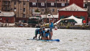 Pieminister team on SUP board for charity